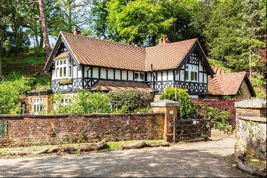 One of a pair of lodge cottages, being individually sold.