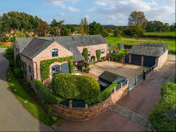 A beautifully appointed detached barn conversion with superb ancillary accommodation found