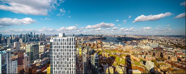 Residence 68C unlocks views overlooking the entire Manhattan skyline, East River, and boro