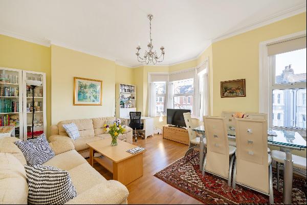 A 4 bed flat for sale in Queen's Park NW6.