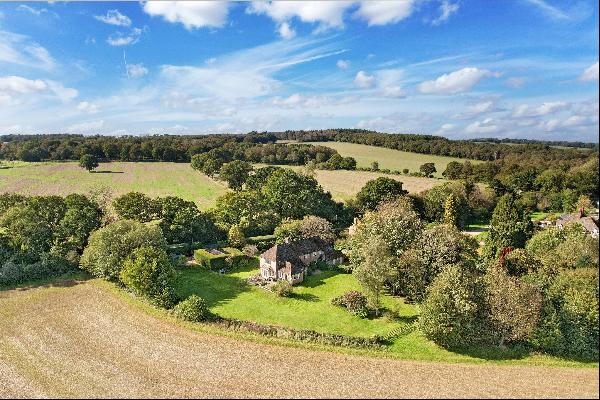 An attractive tile-hung detached family house, surrounded by picturesque rolling countrysi