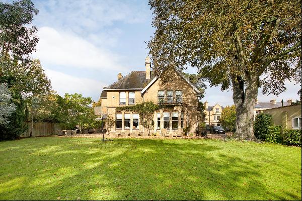 A beautifully refurbished former vicarage offering two large flats, garaging, parking and 