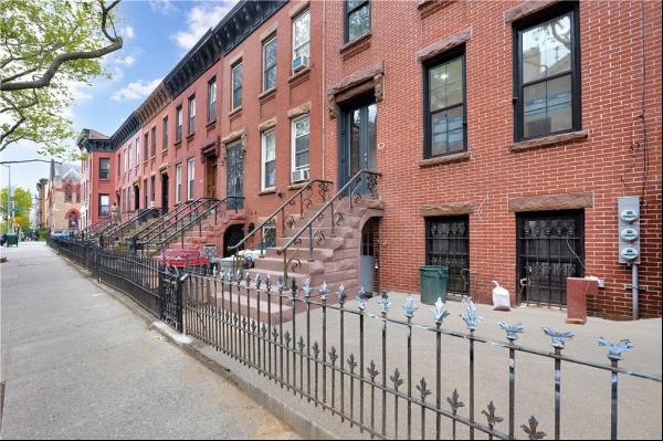 Welcome to this stunning fully renovated 2023 two-family brownstone located in the highly 