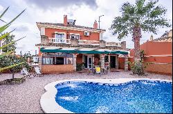 Two-story house with pool.