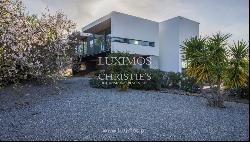 Contemporary 4-bedroom villa with sea views for sale in Estói, Algarve