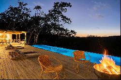 Newly-built house at the edge of the valley, surrounded by the Atlantic Forest