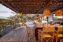 Newly-built house at the edge of the valley, surrounded by the Atlantic Forest