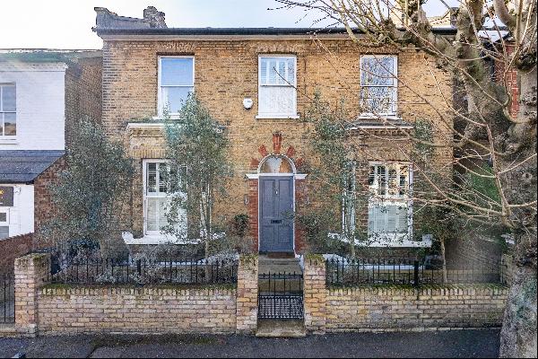 A double-fronted period house for sale with a south west facing garden in a quiet cul-de-s