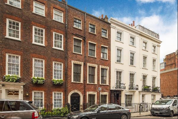 An unmodernised Grade II listed townhouse for sale in Mayfair W1K