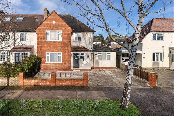 A four bedroom, two bathroom semi detached family home nestled on a popular tree-lined res