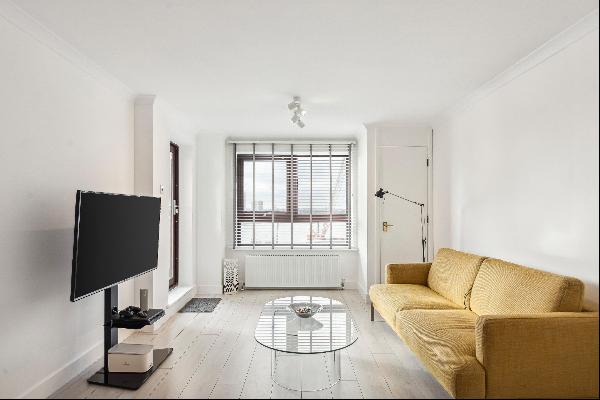 A newly renovated apartment in Free Trade Wharf with river views.