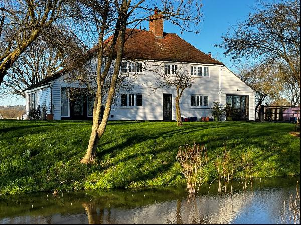An exceptionally, well-presented four-bedroom farmhouse in a peaceful rural location, set 