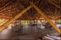 Bamboo house on a deserted and preserved beach