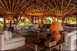 Bamboo house on a deserted and preserved beach