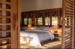 Bamboo house on a deserted and preserved beach