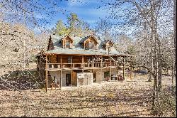 A True Custom Log Home With Creek Frontage