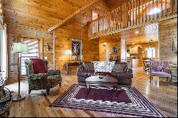 A True Custom Log Home With Creek Frontage