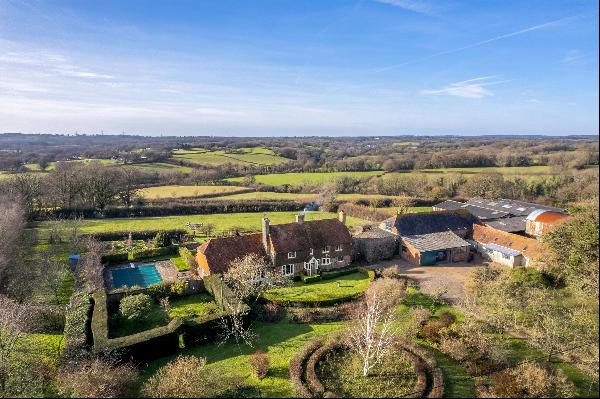 A wonderful Grade II listed farmhouse with stunning rural views and 90.3 acres, farmed und