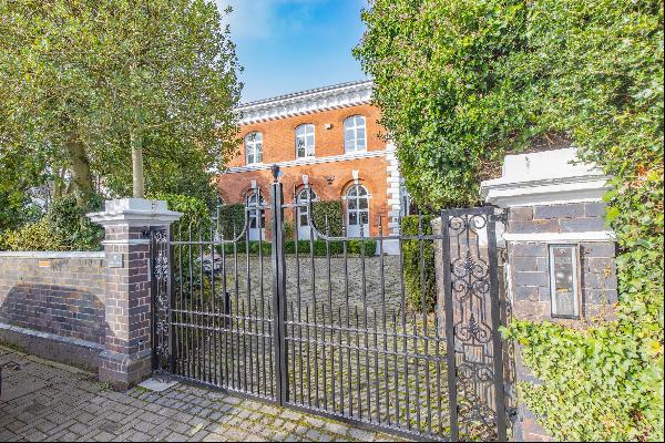 A handsome and beautifully appointed Grade II* listed family home set within mature walled