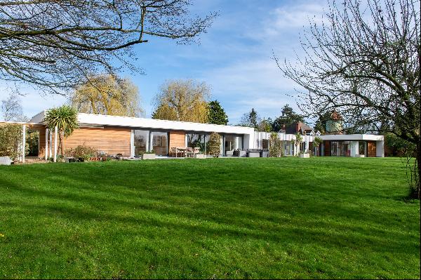 A stunning contemporary house in a generous plot with a beautiful walled garden.