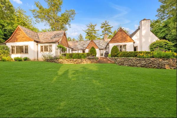 Desirable GREAT NECK ESTATES! This exquisite 5 Bedroom 6.5 Bath expanded Tudor ranch is an