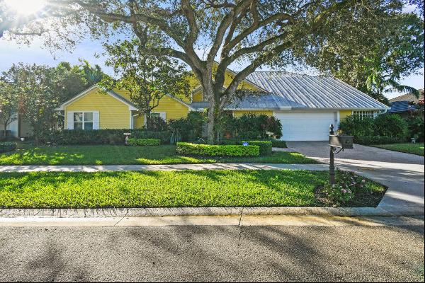 This exquisite home boasts an enchanting blend of coastal charm and timeless elegance, fea