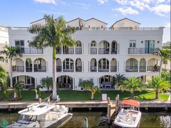 In esteemed Las Olas Isles, this updated townhome epitomizes waterfront living with privat