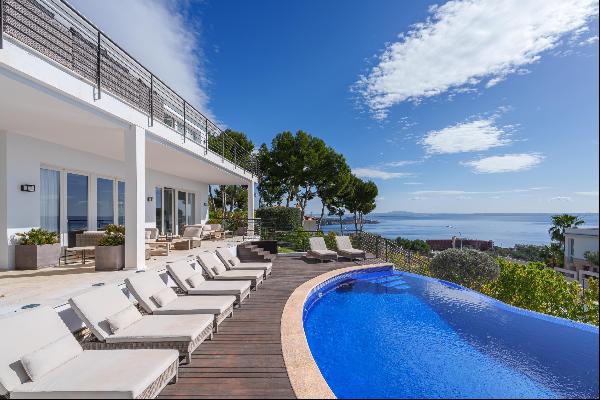 An outstanding contemporary five bedroom villa with beautiful sea views for sale in Cas Ca