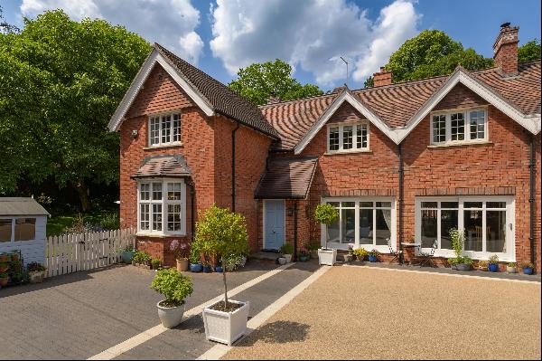An exceptional three-bedroom house with private walled gardens, parking and stunning commu