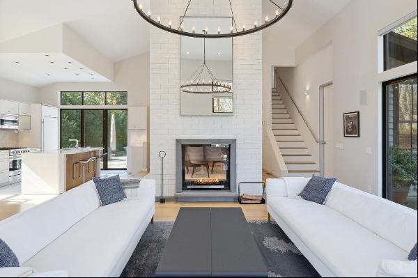 Spend your summer days in this chic East Hampton modern home with an open floor plan bathe