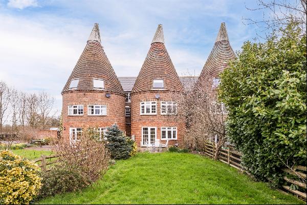 A wonderful oast house, forming the central section of three attached oast houses,  with f