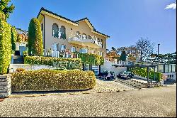 Lugano-Comano: elegant villa with large garden & panoramic view for sale