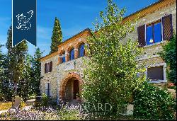Luxury estate with a 10,000-sqm private park for sale framed by Siena's leafy hills