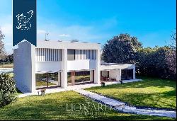 Exclusive property in a modern design with a big private park and a bocce field for sale i