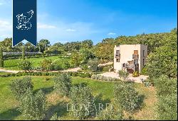 Luxury estate with a farmstead, villa and a cottage for sale in Tuscany, on the Maremma hi