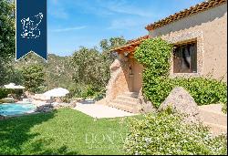 Typical stone villa with a stunning pool for sale in Porto Cervo, surrounded by nature amo