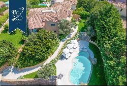 Typical stone villa with a stunning pool for sale in Porto Cervo, surrounded by nature amo