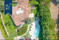 Typical stone villa with a stunning pool for sale in Porto Cervo, surrounded by nature amo