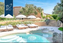 Typical stone villa with a stunning pool for sale in Porto Cervo, surrounded by nature amo