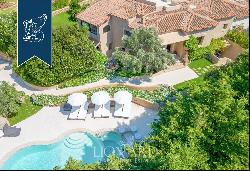 Typical stone villa with a stunning pool for sale in Porto Cervo, surrounded by nature amo