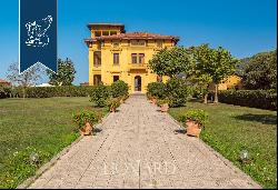 Hotel in an Art-Nouveau villa with a tower and pool for sale in Tuscany, near Lucca