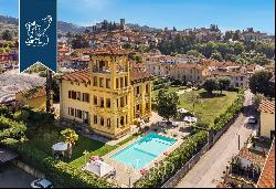 Hotel in an Art-Nouveau villa with a tower and pool for sale in Tuscany, near Lucca