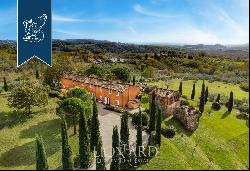 Luxury villa with a pool and volleyball court for sale on Lucca's hills