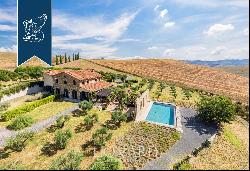Charming Tuscan farmstead with a stone pool for sale in the heart of Val d'Orcia