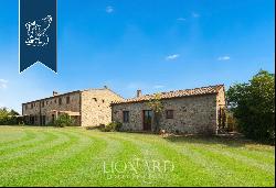 Charming agritourism resort with organic vineyards and olive groves for sale in Tuscany