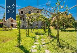 Typical tuscan villa with a garden and a small lake for sale in Pietrasanta, Versilia
