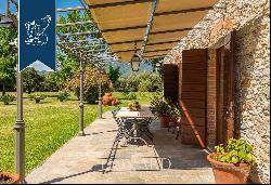 Typical tuscan villa with a garden and a small lake for sale in Pietrasanta, Versilia