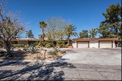 This is a custom home with acreage in a small gated community near the STRIP!