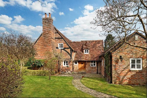 An utterly charming, 17th century Grade II Listed cottage, set within beautiful gardens wi