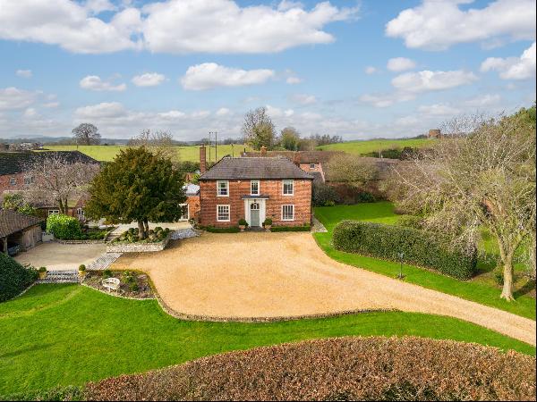 A handsome and beautifully presented period country house with landscaped grounds and fant